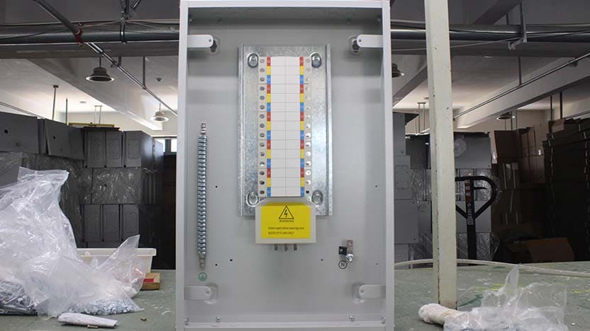 person locating distribution box in utility room